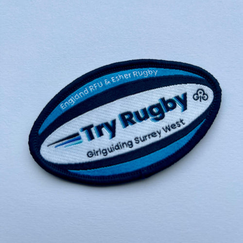 Challenge badge in the shape of a rugby ball

